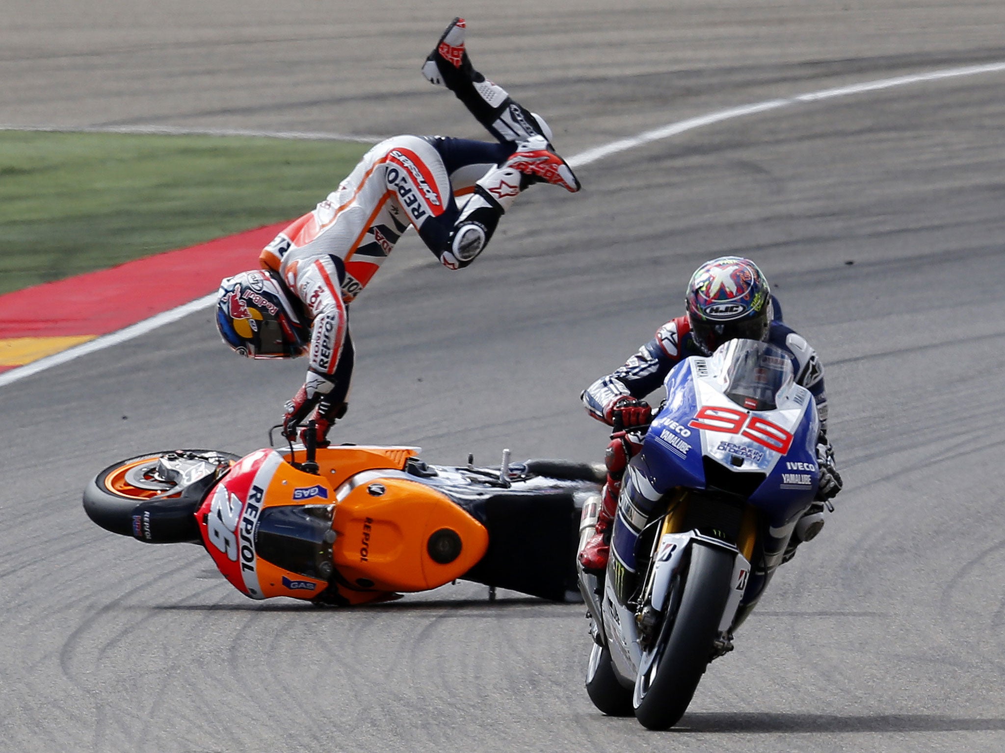 Marc Marquez extended his MotoGP points lead by winning the Aragon Grand Prix but his win came only after he played a part in the crash of Honda team-mate Dani Pedrosa. Marquez grazed the back of Pedrosa’s bike, causing Pedrosa to lose control and slide d