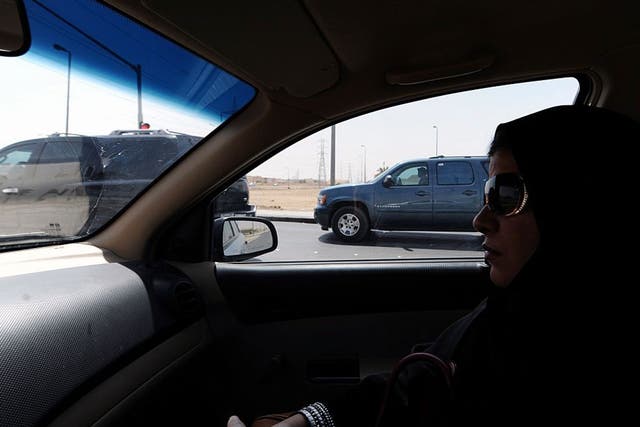 A Saudi woman sits in a car in Riyadh: After activists called for a day of defiance against women driving ban, a senior cleric says it damages their ovaries and unborn children