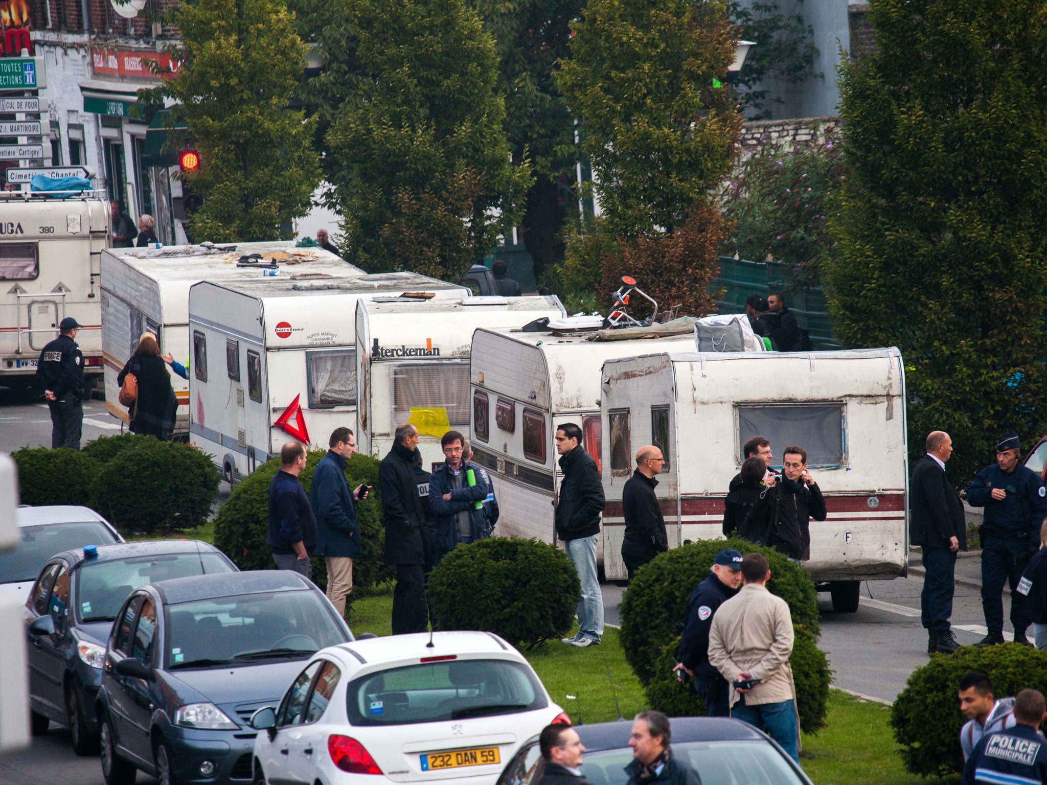 Security forces prepare to evacuate caravans belonging to the Roma community during the dismantling of a camp in Roubaix