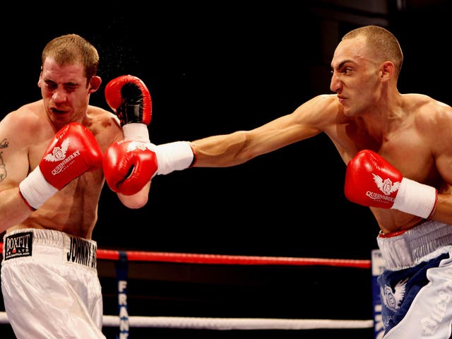 Johnny Greaves takes some of the punishment that added up to 96 defeats in 100 fights