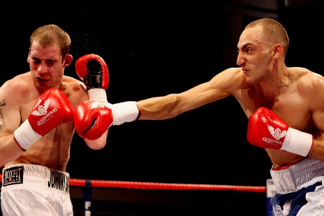 Johnny Greaves takes some of the punishment that added up to 96 defeats in 100 fights