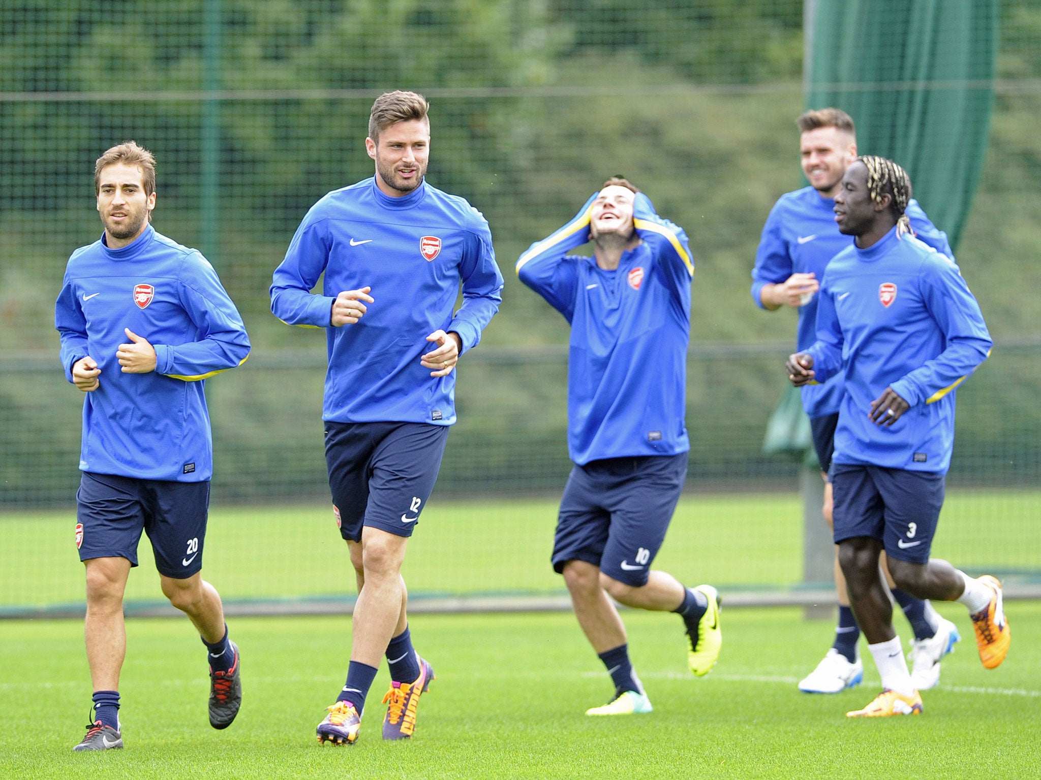 Jack Wilshere enjoys a joke during Arsenal training