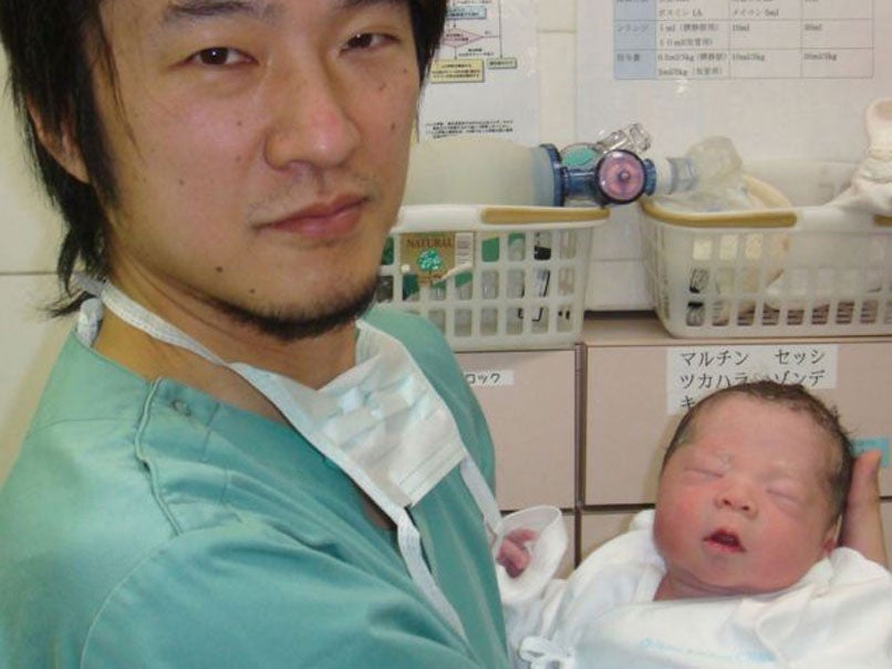 Dr. Kazuhiro Kawamura of the St. Marianna University School of Medicine in Kawasaki, Japan, Kawamura holds a newborn baby whose 30-year-old mother was treated for primary ovarian insufficiency, sometimes called premature menopause, in Tokyo. The mother was one of the five women out of 27 treated who were able to produce usable eggs for in vitro fertilization, Kawamura said.