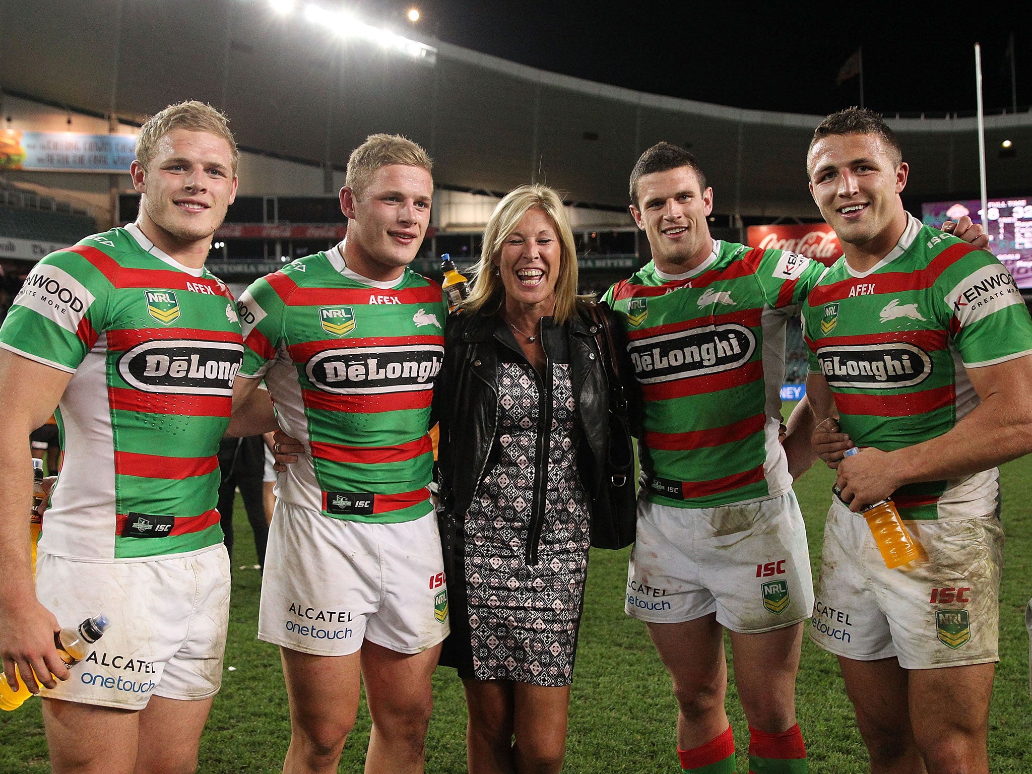 All four of the Burgess brothers: (L-R) Tom, George, Luke and Sam with their mother Julie