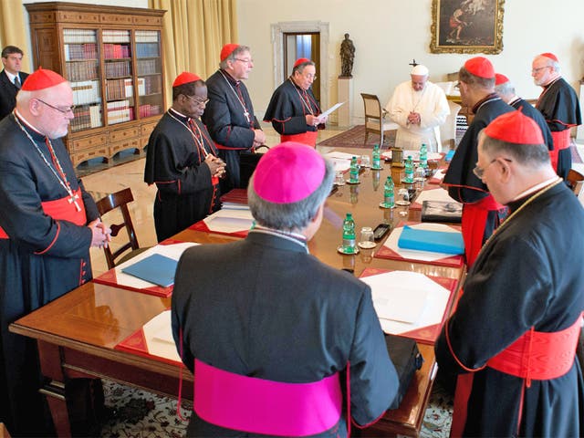 Pope Francis, at the head of the table, and the eight cardinals, on the first of three days of talks at which he wants to modernise the Catholic Church