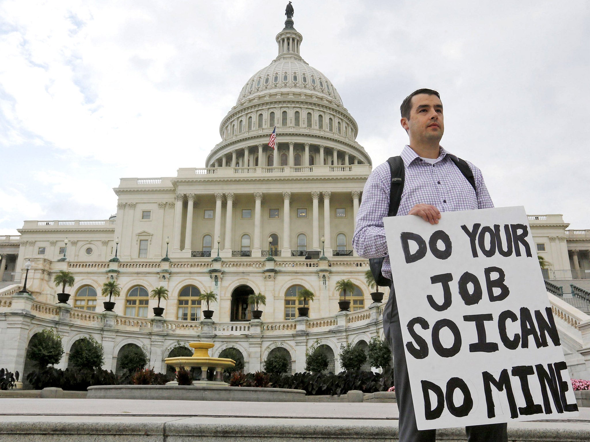 A federal employee on the steps of the US Capitol building in Washington