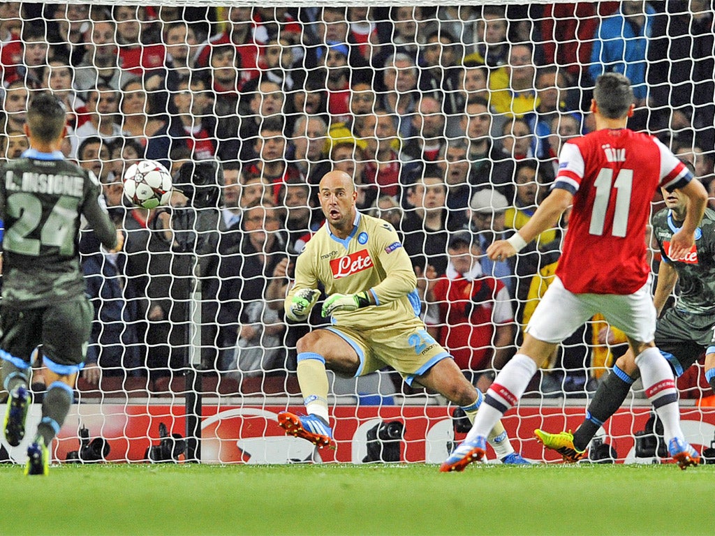 Özil places the ball beyond Pepe Reina's reach