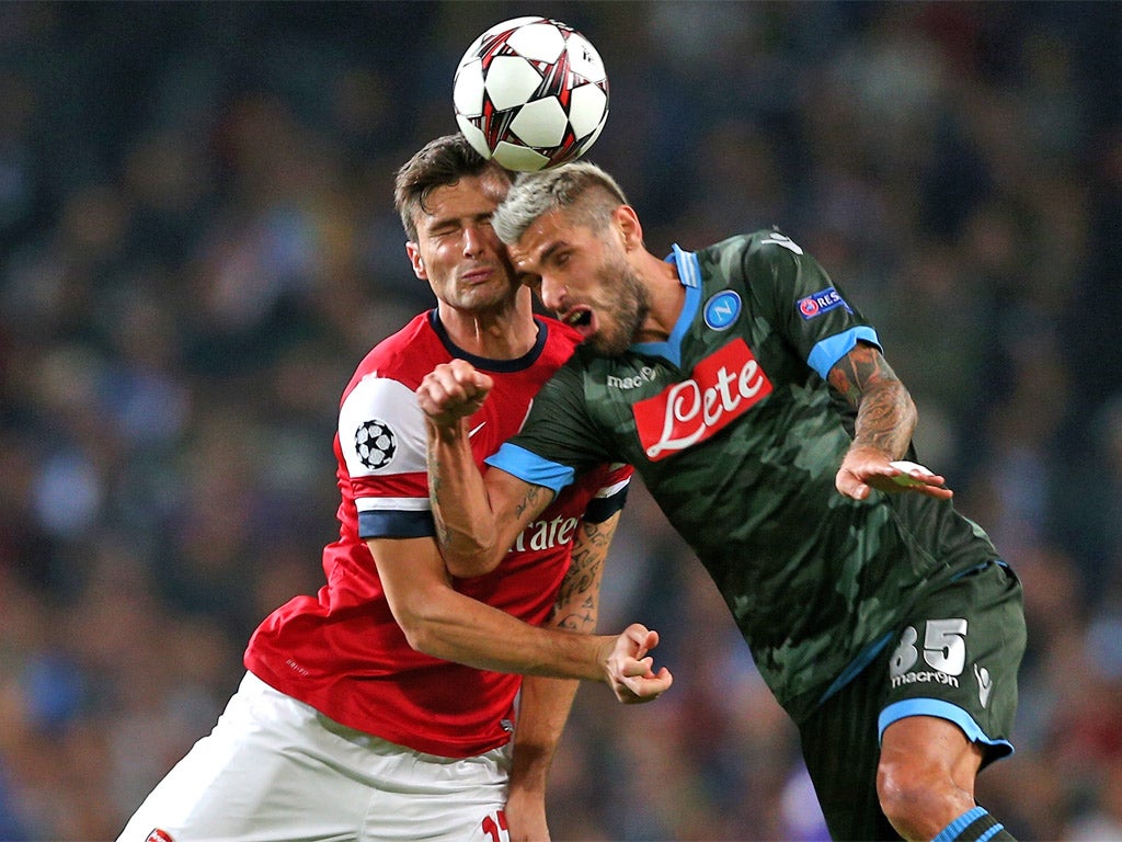 Olivier Giroud and Valon Behrami contest a header (Getty)