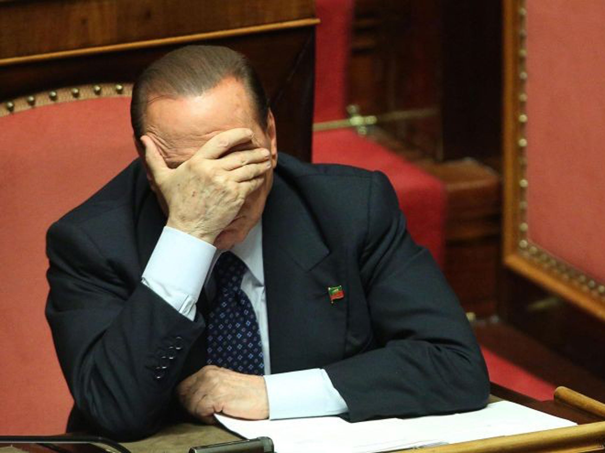 Former Italian Prime Minister Silvio Berlusconi of the People of Freedom (PDL) party reacts at the Senate, Rome