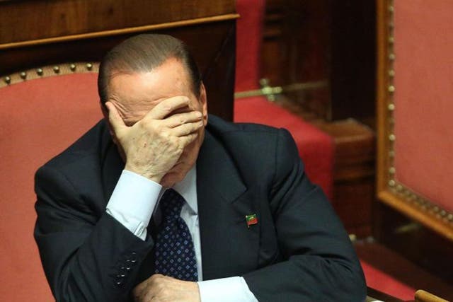 Former Italian Prime Minister Silvio Berlusconi of the People of Freedom (PDL) party reacts at the  Senate, Rome