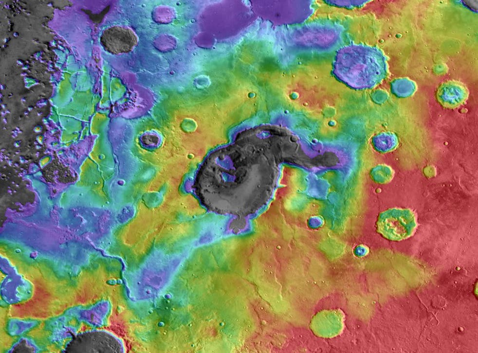 This image shows digital elevation data overlaid on daytime thermal infrared images of Eden Patera, the type example of an ancient supervolcano on Mars. Red colors are relatively high and purple-gray colors are low. The caldera is approximately 1800 metre