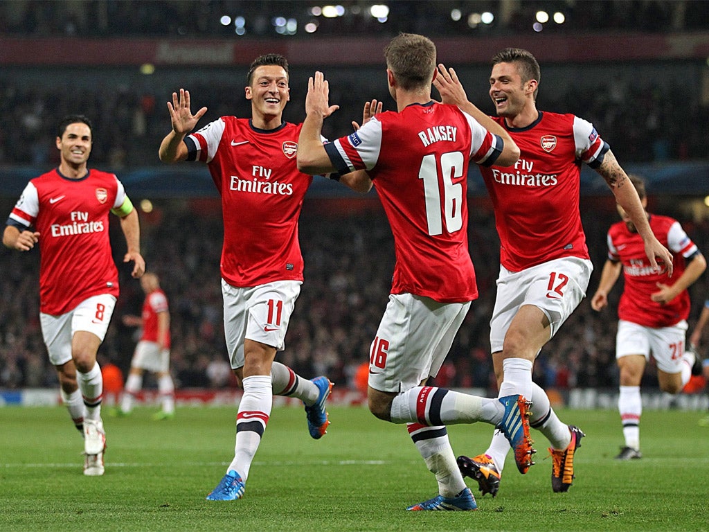 Mesut Özil (second left) has added a new dimension to Arsenal’s midfield