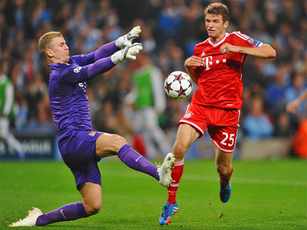 Thomas Muller rounds Joe Hart for Bayern's second