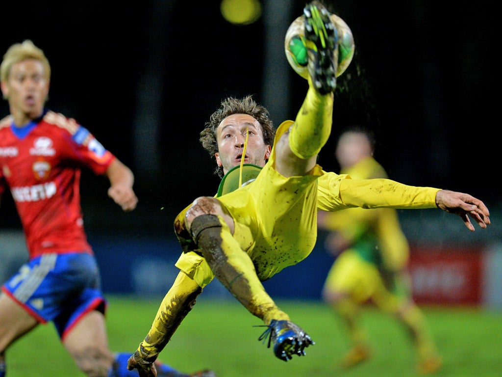 Anzhi's Alan Gatagov acrobatically strikes the ball during a recent match against CSKA Moscow