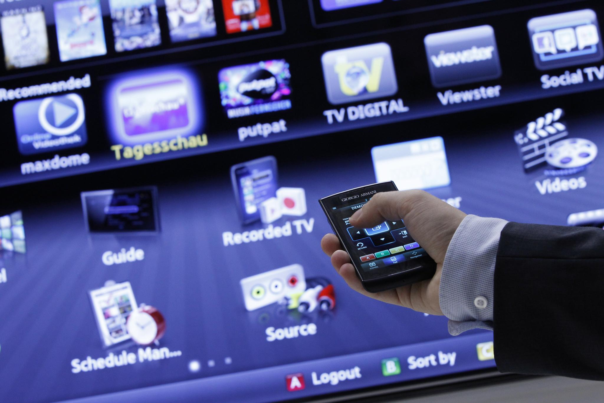 An exhibitor demonstrates a Samsung Smart TV at the IFA consumer electronics fair in Berlin, August 31, 2011. 