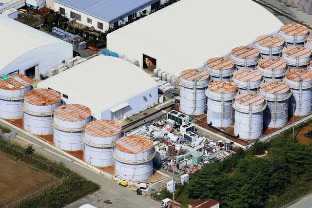 This aerial photo shows the storage tank, fifth from left at left plot, which workers detected the water dripping from the top, at the Fukushima Dai-ichi nuclear plant at Okuma town in Fukushima prefecture, northeastern Japan