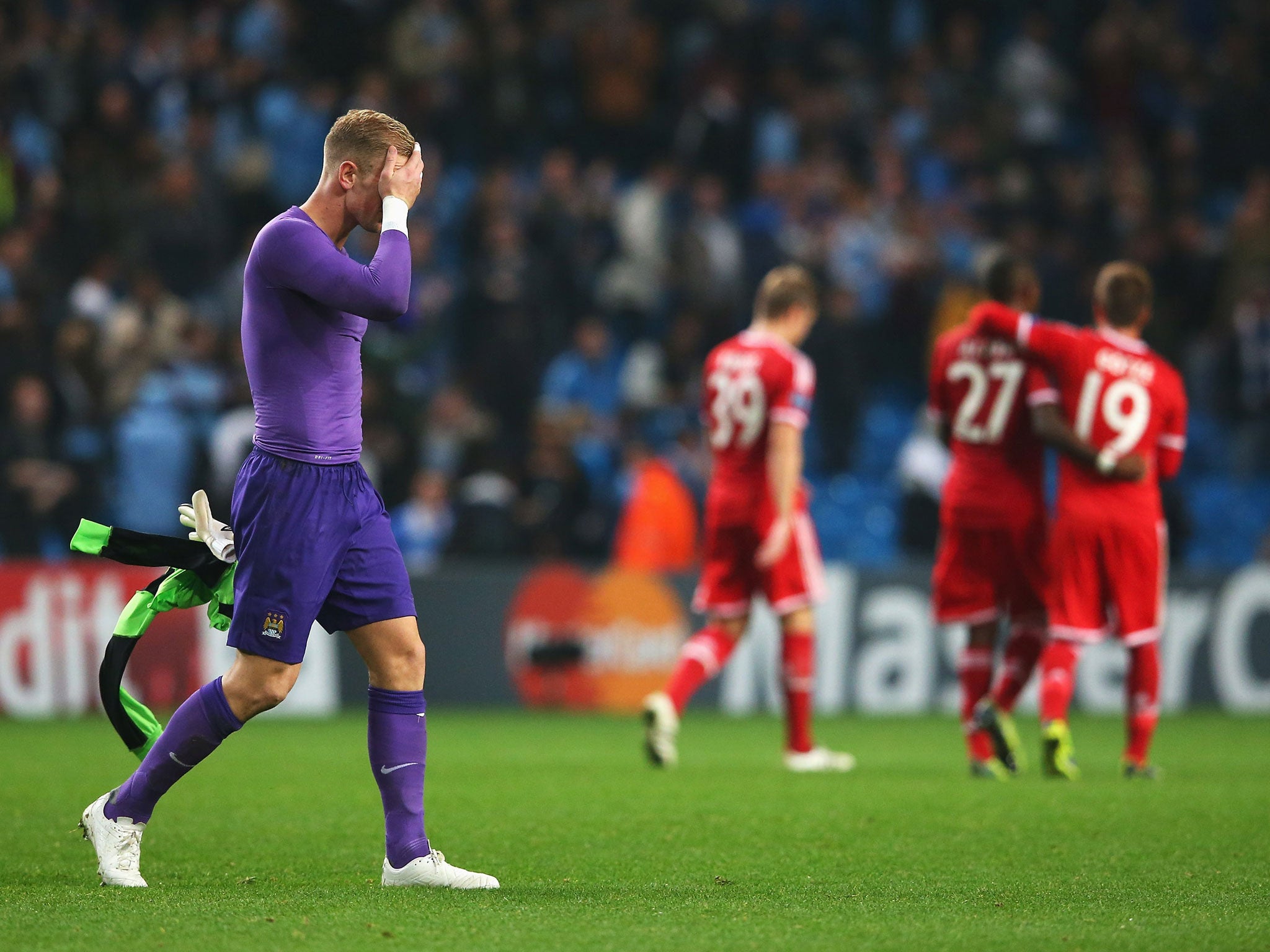Joe Hart holds his head in his hands after the 3-1 defeat to Bayern Munich