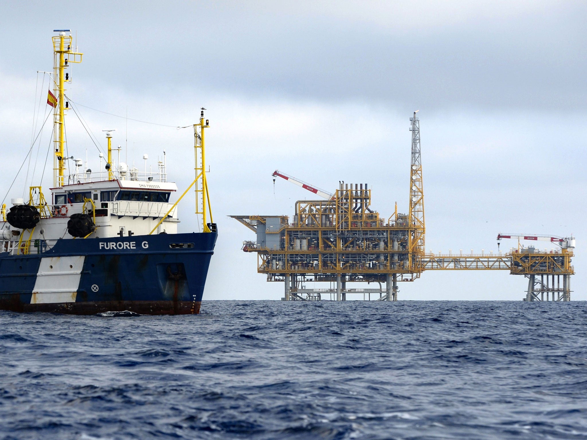 A vessel navigates near a platform, part of the Castor Project, located in the Ebro Delta off the coast of Alcanar