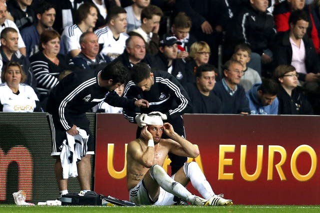 Michu has his head bandaged after suffering a cut to the head in the win over St Gallen