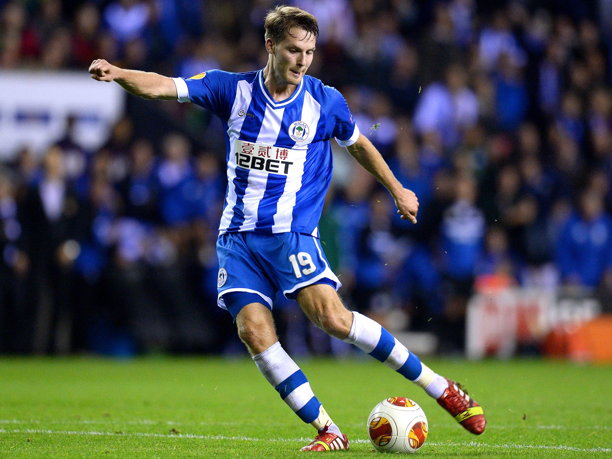 Nick Powell, on-loan from Manchester United, scored twice for Wigan in their 3-1 victory over NK Maribor