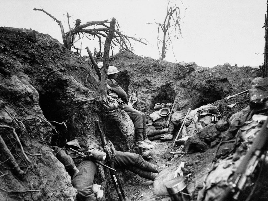 British infantrymen rest in a captured German trench during the Somme offensive of 1916.