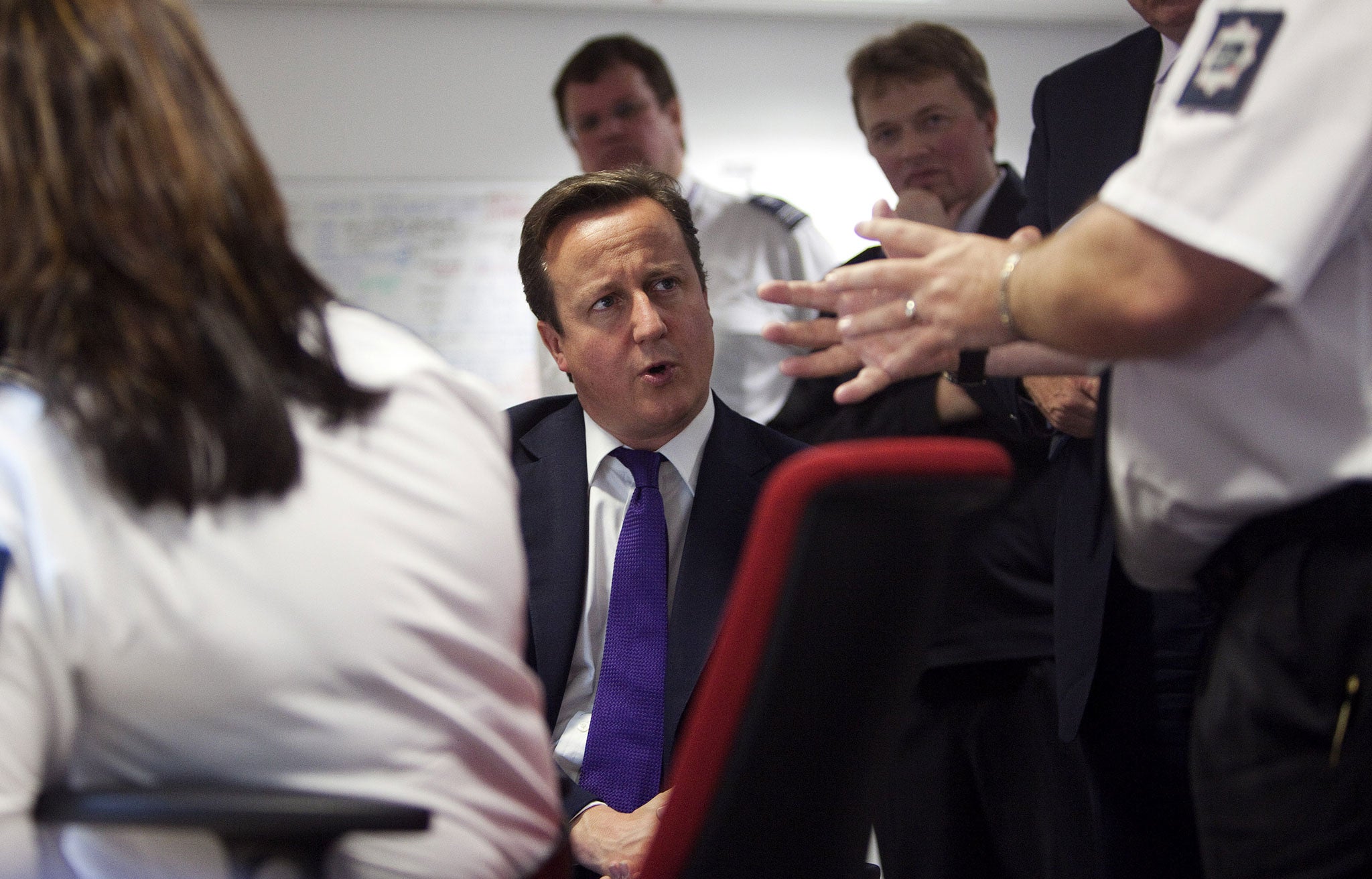 Prime minister David Cameron talks with border agency officials in 2011