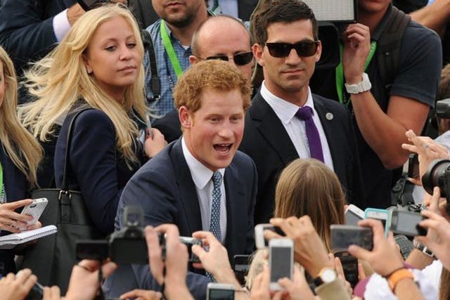 Prince Harry, who is in Sydney representing the Royal family at the International Fleet Review, meets members of the public during a walk about at Campbell's Cove in Sydney Harbour.