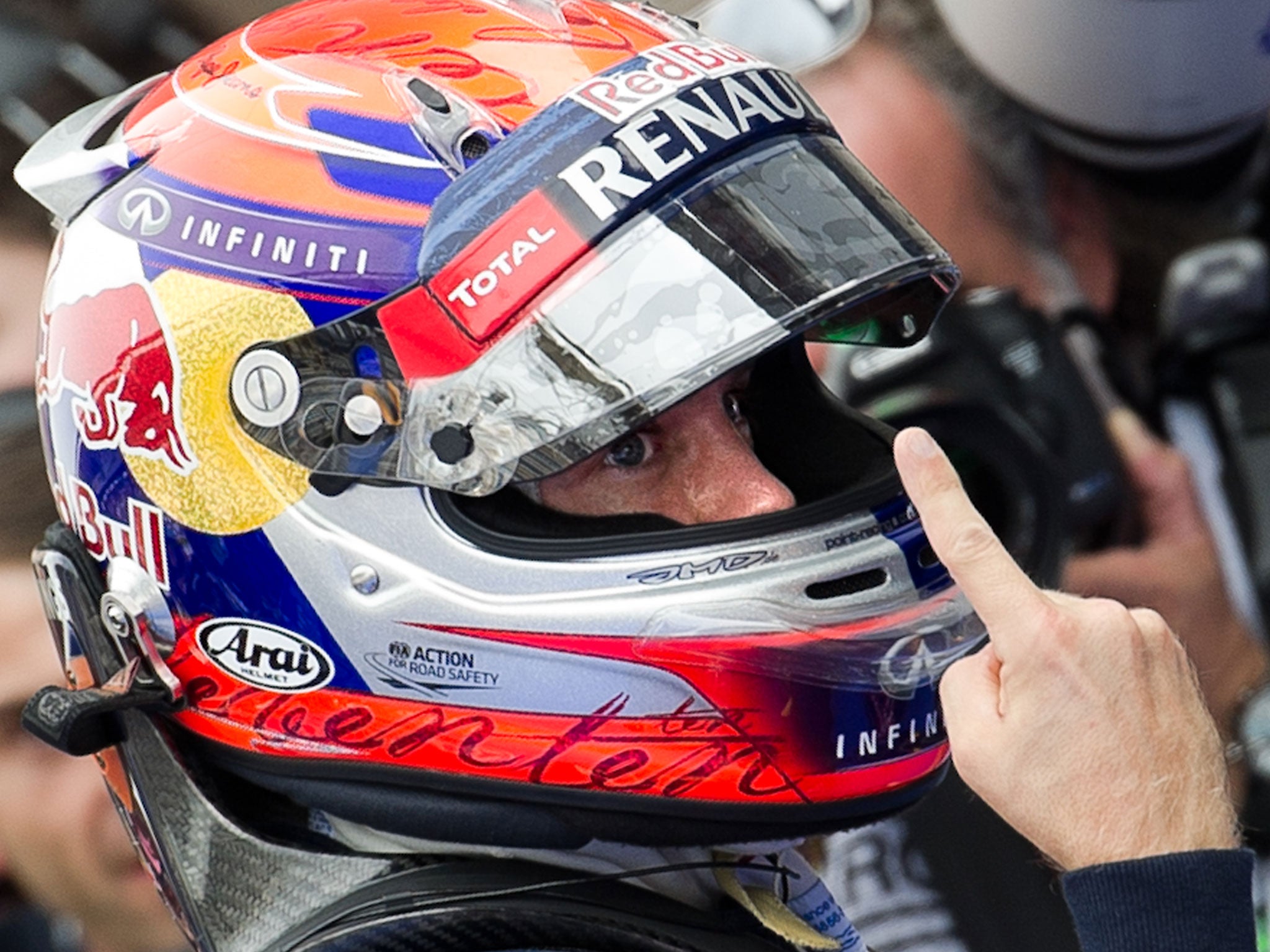 Red Bull driver Sebastian Vettel of Germany gestures as he celebrates his pole position at the end of the qualifying session of the Formula One Korean Grand Prix in Yeongam