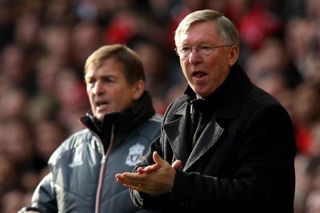 From the sidelines: Kenny Dalglish (left) and Sir Alex Ferguson watch on