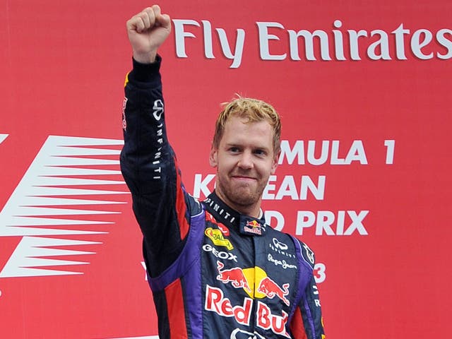 Sebastian Vettel celebrates on the podium in Korea