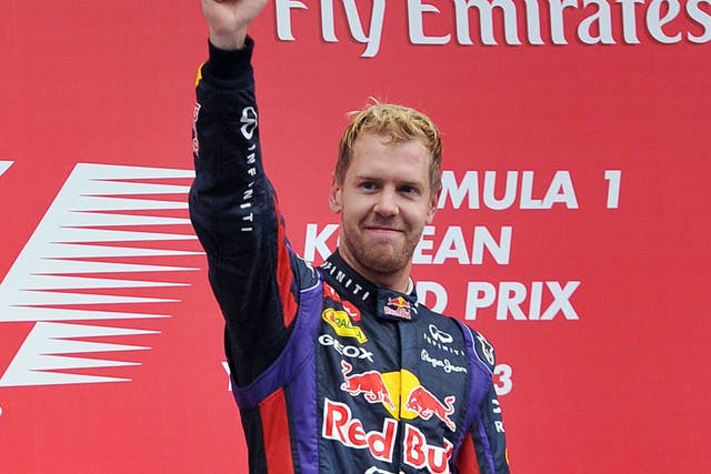 Sebastian Vettel celebrates on the podium in Korea