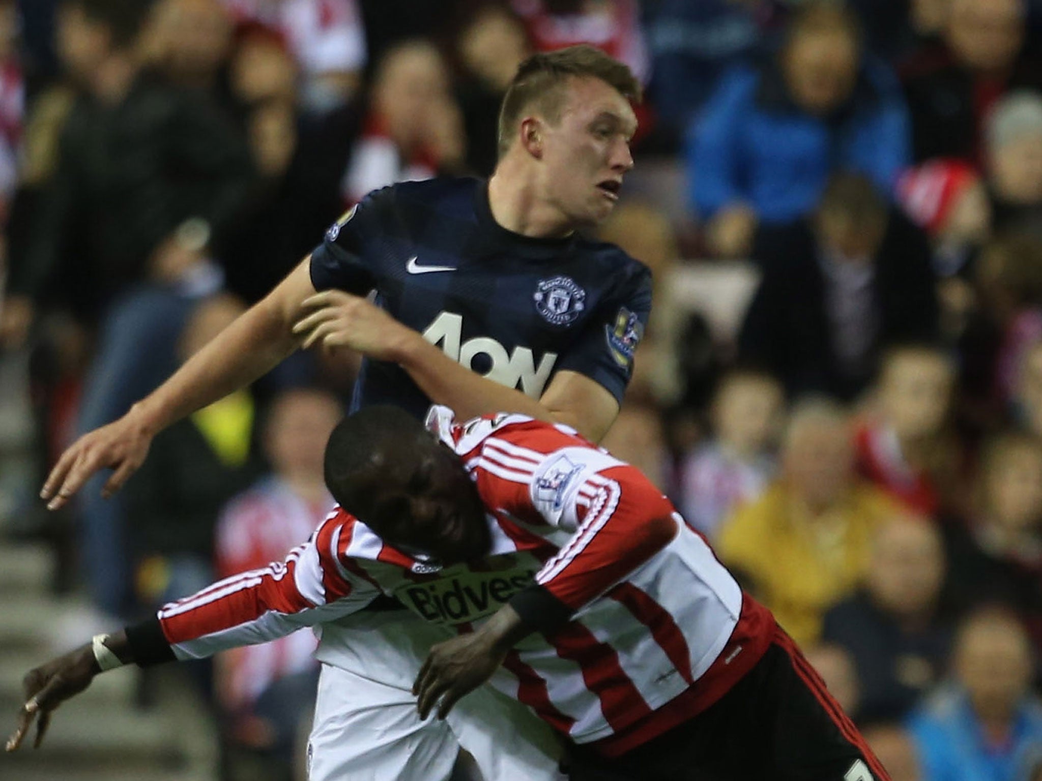 Phil Jones wins an aerial battle against Jozy Altidore