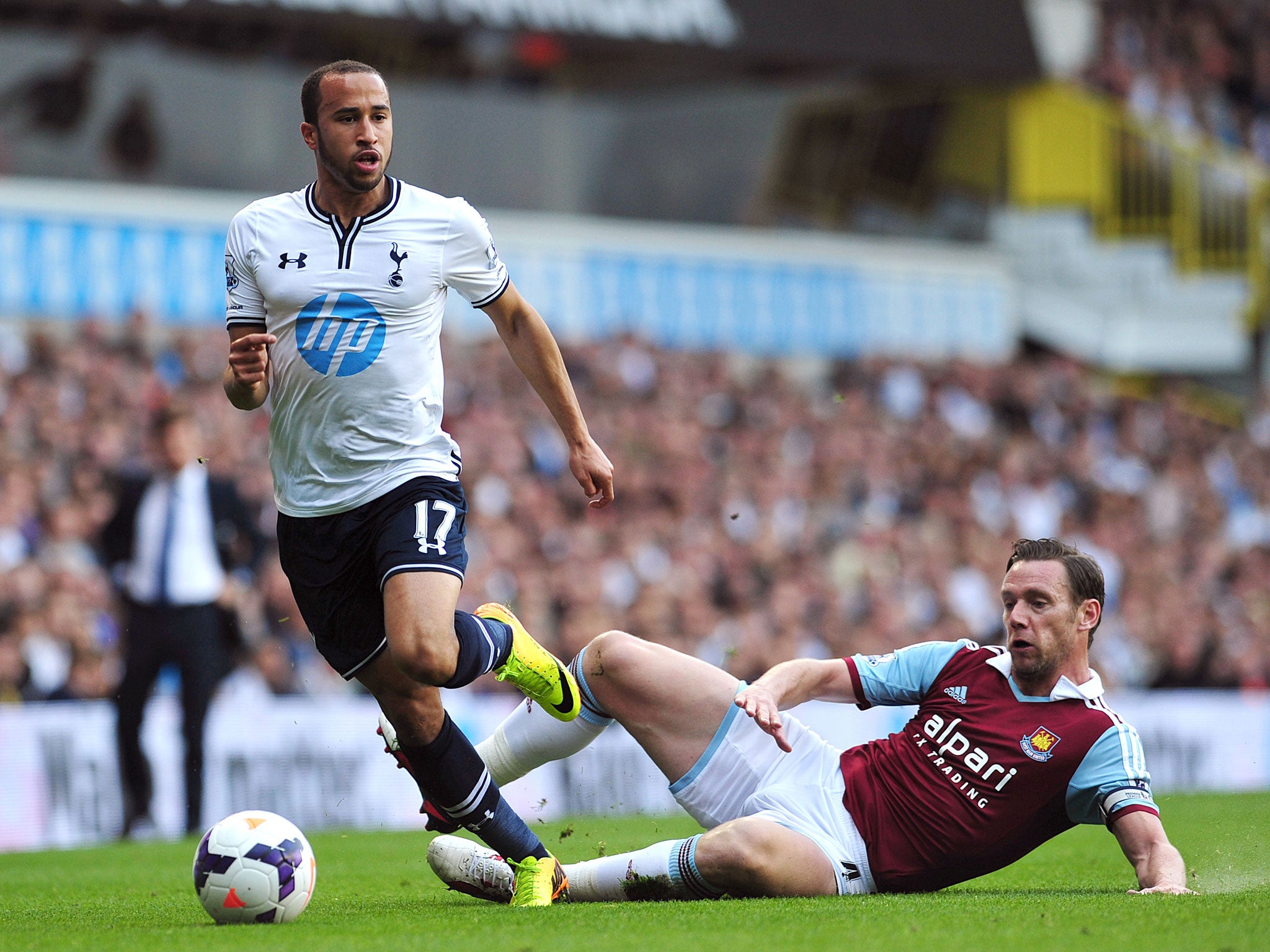 Andros Townsend goes past Kevin Nolan
