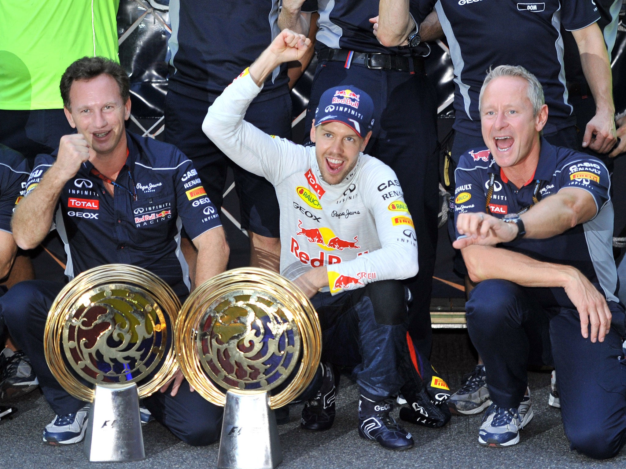 YEONGAM-GUN, SOUTH KOREA - OCTOBER 06: Sebastian Vettel of Germany and Infiniti Red Bull Racing celebrates with team mates after winning the Korean Formula One Grand Prix at Korea International Circuit