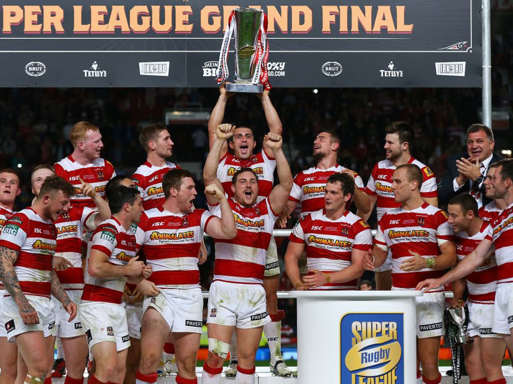 Wigan celebrate with the trophy after their Grand Final victory