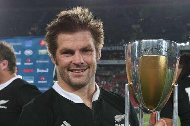 New Zealand captain Richie McCaw poses with the Championship trophy