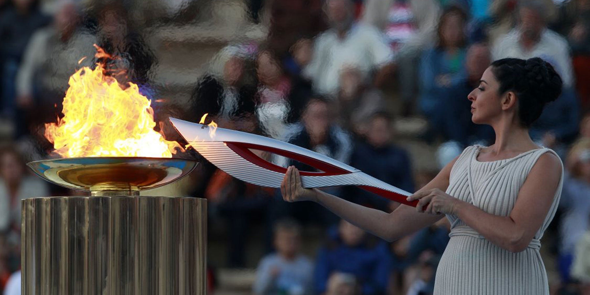 The Olympic flame is lit in Athens before its transfer to the Sochi Games