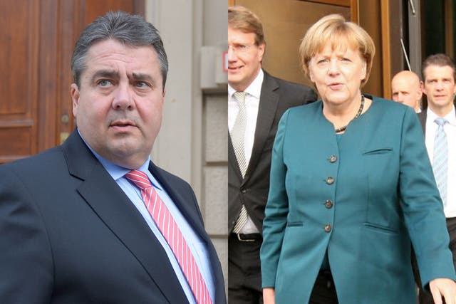 Social Democrat (SPD) leader Sigmar Gabriel, right, and German Chancellor Angela Merkel
