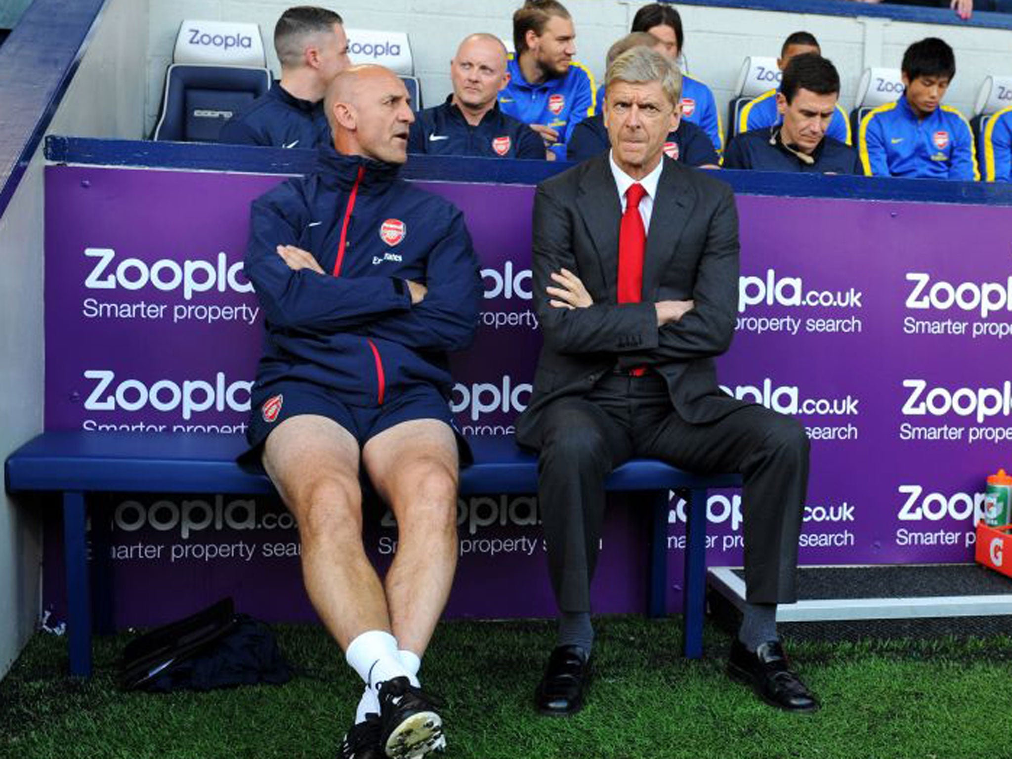 Arsène Wenger and assistant Steve Bould talk tactics yesterday