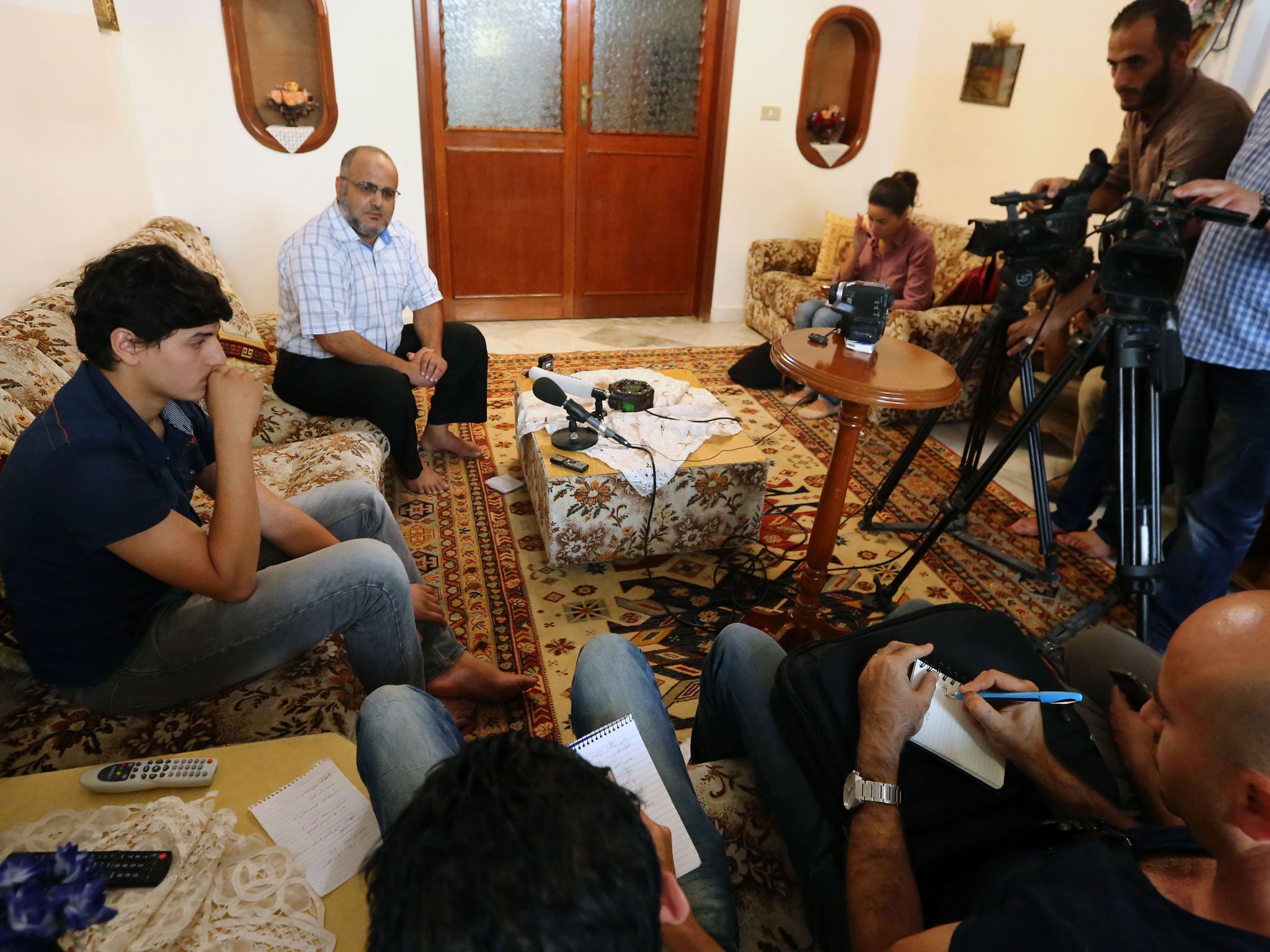 Abdul Moheman al-Raghie, left, and Nabih al-Raghie, the son and brother respectively of al-Qa'ida suspect Abu Anas al-Libi have spoken to the press