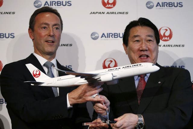 Airbus Japan's Chief Executive Fabrice Bregier (left) and Japan Airlines President Yoshiharu Ueki announced the carrier's order for 31 new planes today 