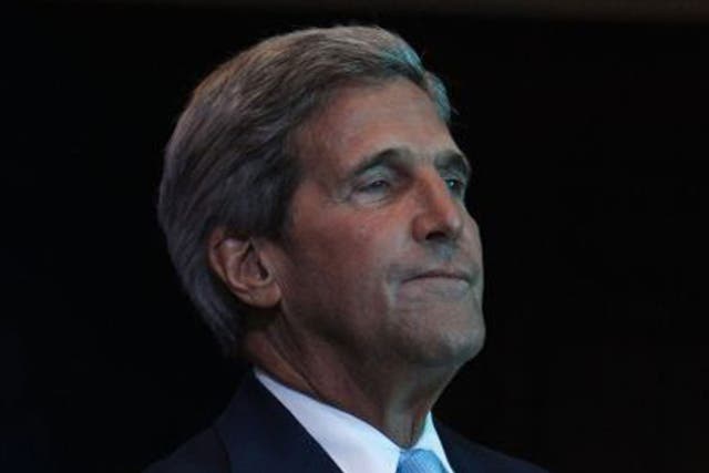 John Kerry waits to speak at the Asia-Pacific Economic Cooperation (APEC) summit in Bali, Indonesia.