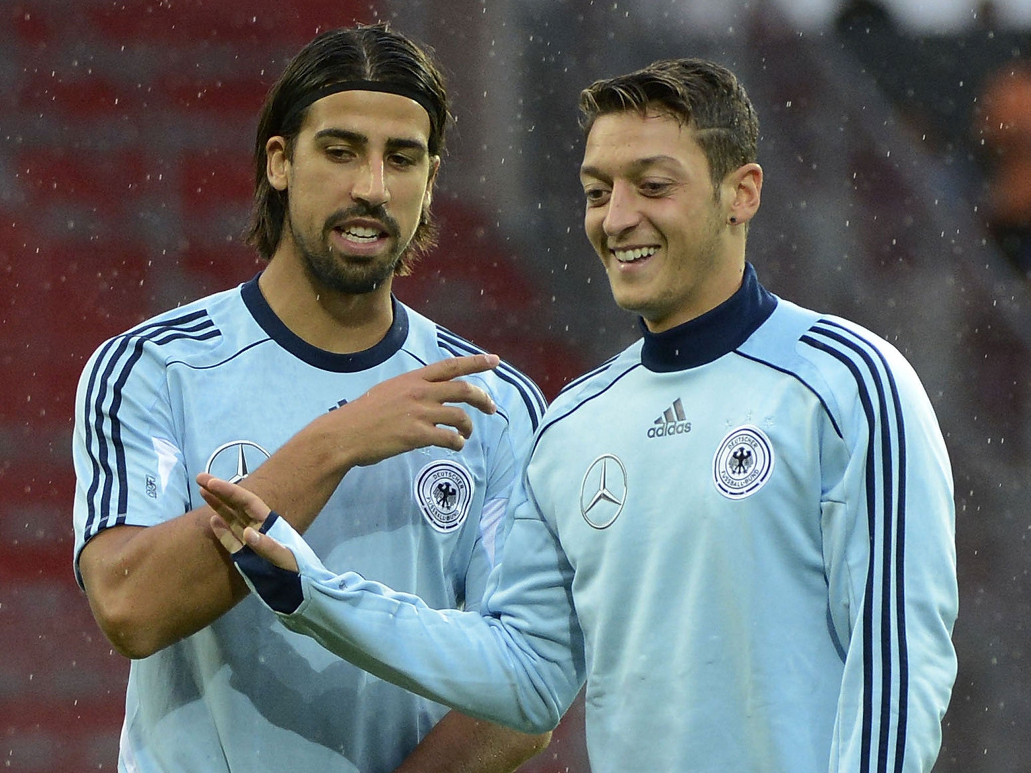Sami Khedira (left) and Mesut Ozil (right) in conversation during training with Germany in August