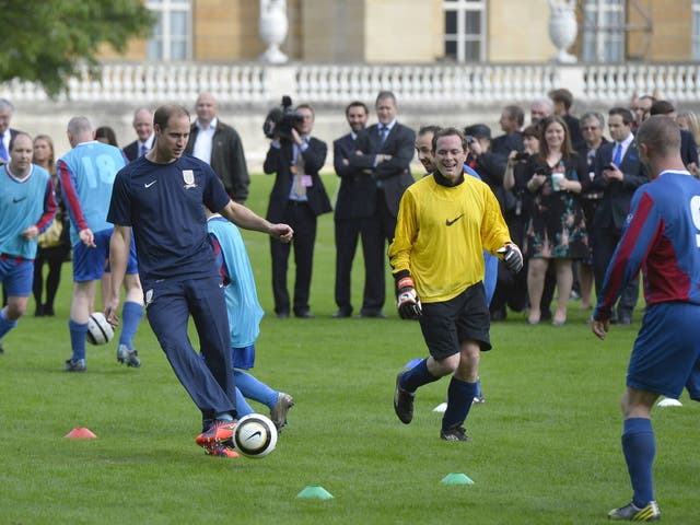 Prince William, Duke of Cambridge trains with players in the grounds of Buckingham Palace