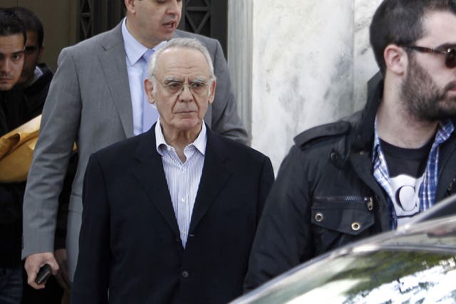 Akis Tsochatzopoulos, led from his Athens mansion after his arrest in 2012