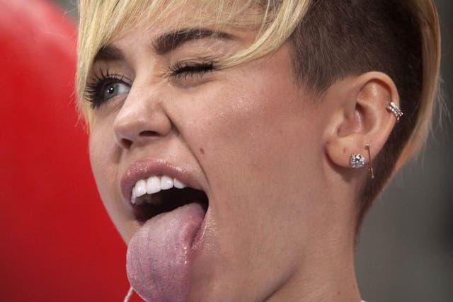 Miley Cyrus has caused controversy by saying she sticks out her tongue so much because she 'keeps having mini strokes'