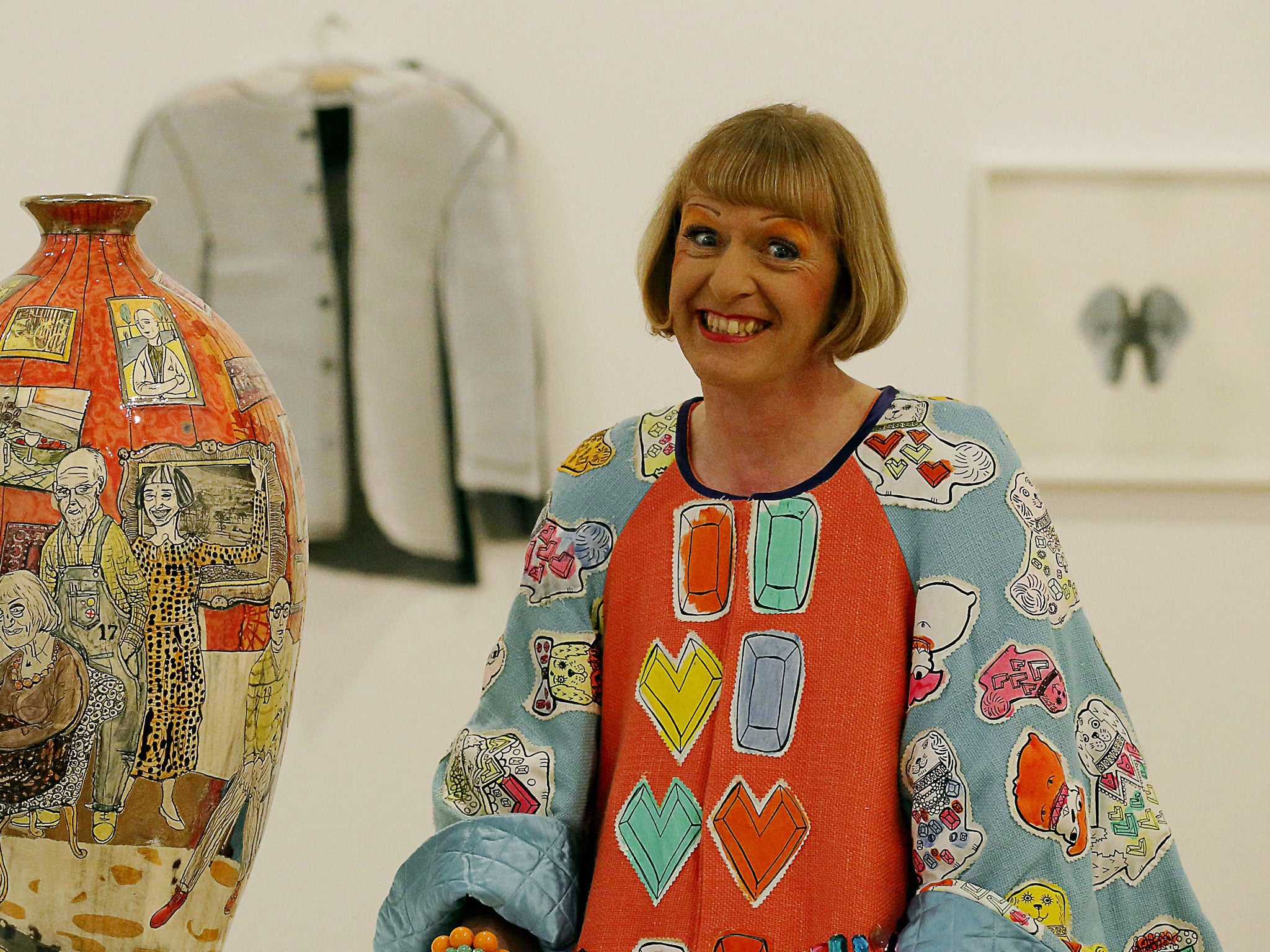 Turner Prize-winning artist Grayson Perry has attacked Damien Hirst's work as 'hackneyed' and 'tatty'