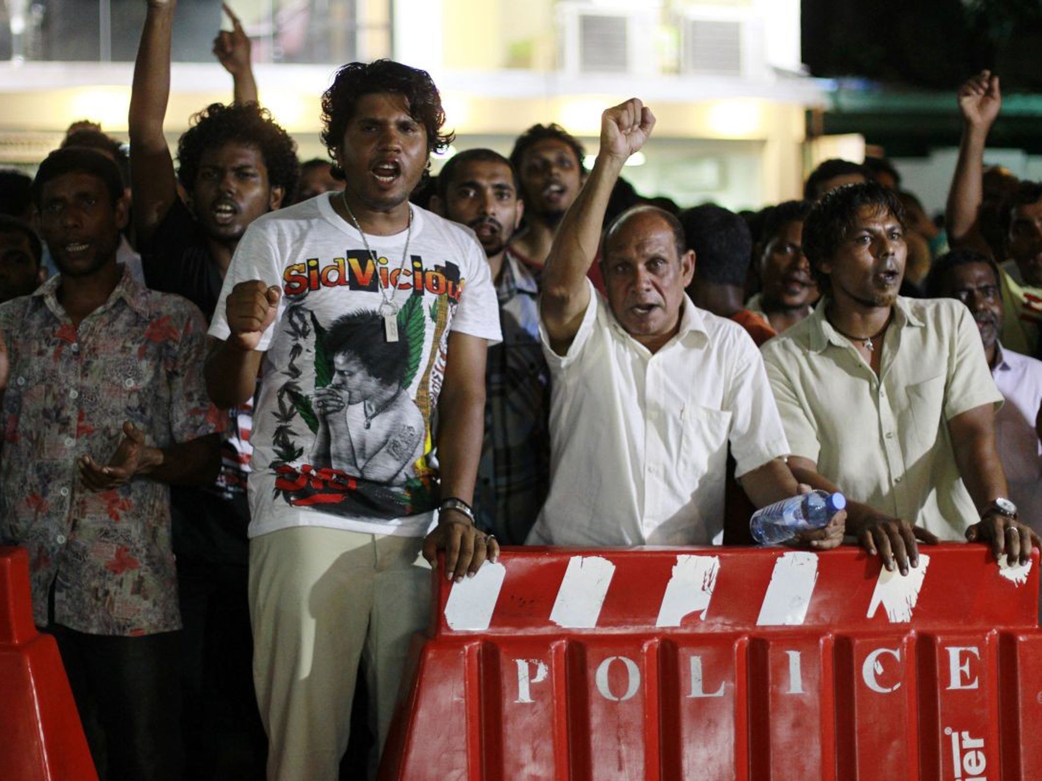 Supporters of former President Mohamed Nasheed shouted slogans near the Supreme Court as they awaited the court decision in Male