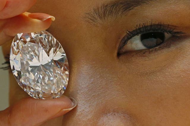 A White diamond has fetched a record $30.6 million at a Sotheby's auction in Hong Kong 