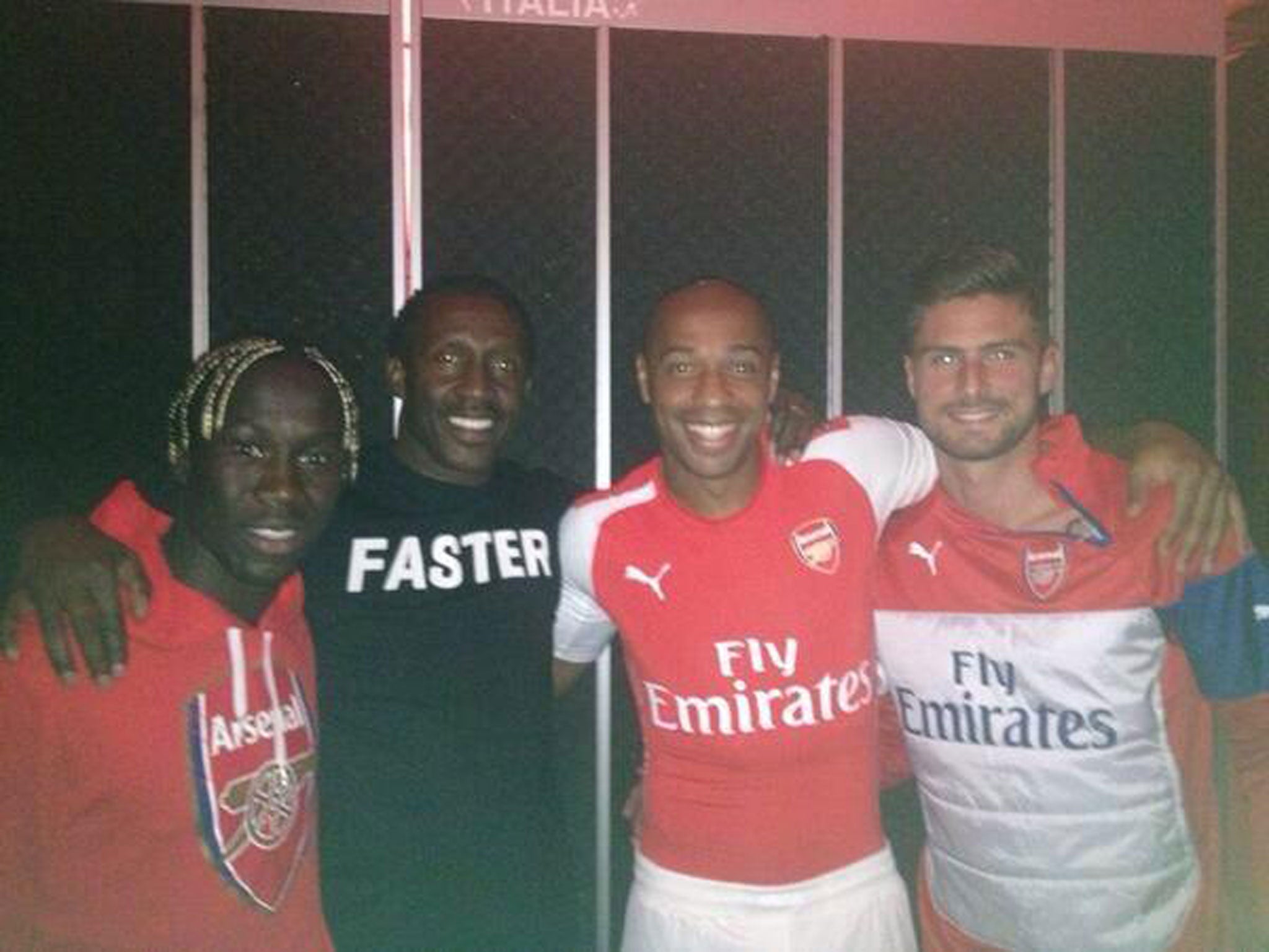 (L-R) Bacary Sagna, Linford Christie, Thierry Henry and Olivier Giroud pictured together with Henry wearing a Puma-branded Arsenal kit